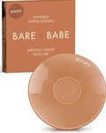 Sensitive Adhesive Nipple Covers in Caramel: a round sticky silicone cover marked Sticky, with its adhesive-free center ring visible, in front of the Caramel Bare Babe box in medical-grade silicone.
