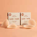 Adhesive & Triangle Nipple Covers Bundle: Bare Babe triangle and round sticky silicone nipple covers shown with two Invisible Nipple Covers boxes, reusable nipple pasties for different necklines