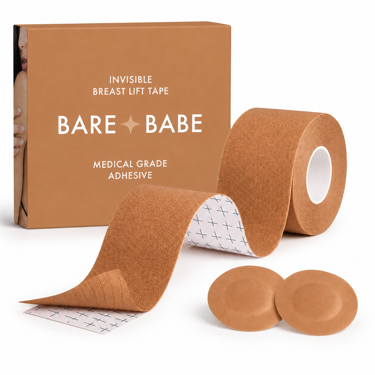 Boob Tape Kit in Caramel: a roll of breast lift tape with grid backing for cutting strips, two matching round satin pasties to cover the nipple first, and the Caramel box marked medical-grade adhesive.