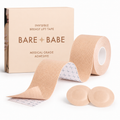Boob Tape Kit in Creme: a roll of breast lift tape with grid backing for cutting strips, two round satin pasties to cover the nipple first, and the Creme box marked medical-grade adhesive.