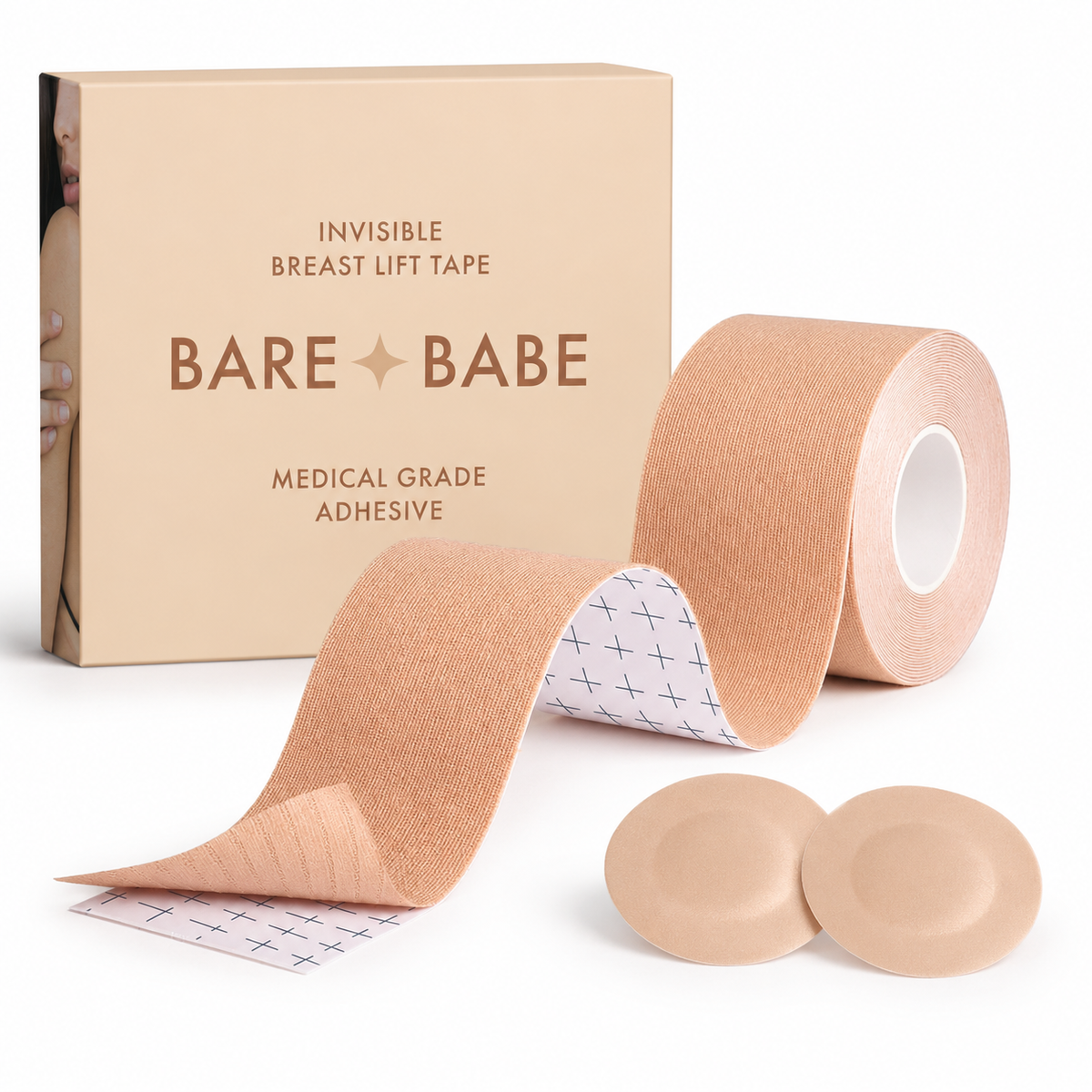 Boob Tape Kit in Honey: a roll of boob tape with grid backing for cutting strips, two round satin pasties to cover the nipple before taping, and the Honey box marked medical-grade adhesive.