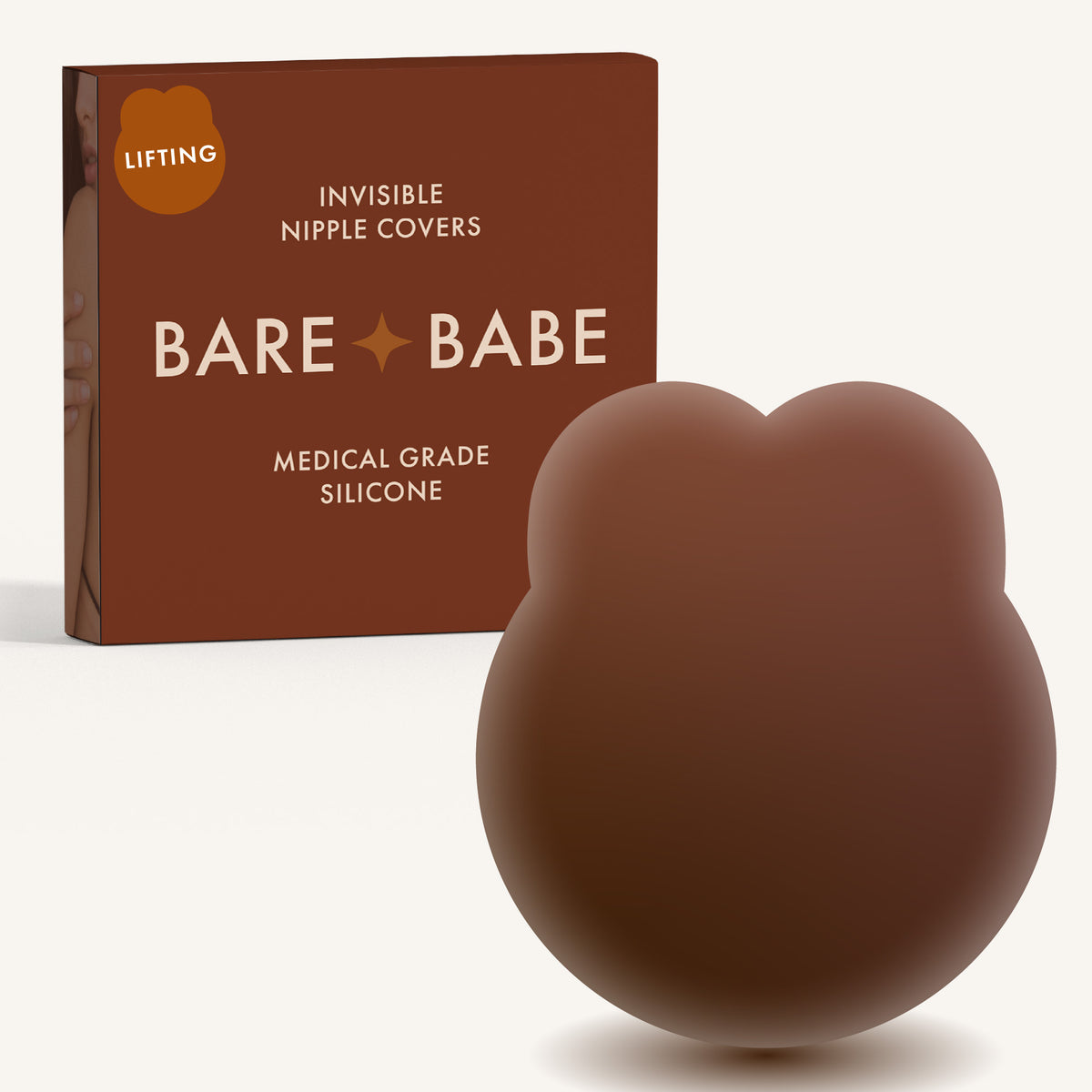 Lifting Nipple Covers (Two-Tabs) in Mocha: two-tab reusable silicone lift nipple cover in front of its Mocha Bare Babe box, labelled Lifting, invisible nipple covers, medical grade silicone