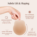 Lifting Nipple Covers (Two-Tabs) features: subtle lift and shaping, gentle lift from the tab design, strong adhesive that stays put through activity, matte full coverage under tight and sheer clothes, and ultra-thin edges that blend with your skin. Hand holds a reusable silicone lift nipple cover by its tabs