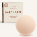 Non-Adhesive Nipple Covers in Creme: a round, matte, grippy silicone nipple cover in front of the Creme Bare Babe box marked Not Sticky and medical-grade silicone, reusable with no adhesive.