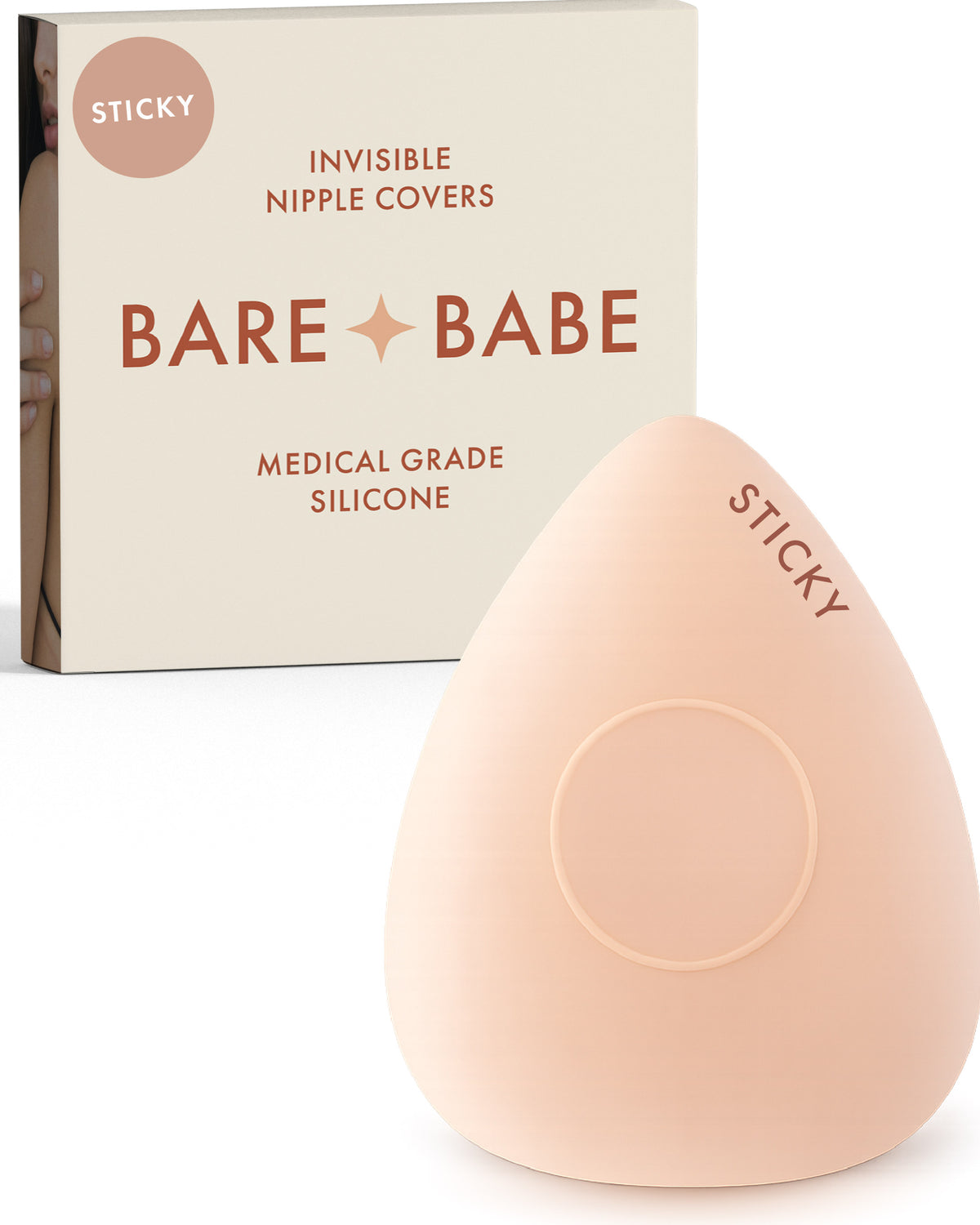 Sensitive Triangle Nipple Covers in Creme: a rounded-triangle sticky silicone nipple cover marked Sticky, with its adhesive-free center ring, in front of the Creme Bare Babe box in medical-grade silicone.