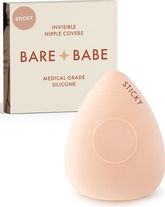 Sensitive Triangle Nipple Covers in Creme: a rounded-triangle sticky silicone nipple cover marked Sticky, with its adhesive-free center ring, in front of the Creme Bare Babe box in medical-grade silicone.