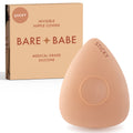 Sensitive Triangle Nipple Covers in Honey: a rounded-triangle sticky silicone nipple cover marked Sticky, with its adhesive-free center ring, in front of the Honey Bare Babe box in medical-grade silicone.