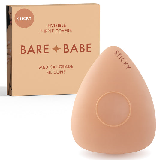 Sensitive Triangle Nipple Covers in Honey: a rounded-triangle sticky silicone nipple cover marked Sticky, with its adhesive-free center ring, in front of the Honey Bare Babe box in medical-grade silicone.