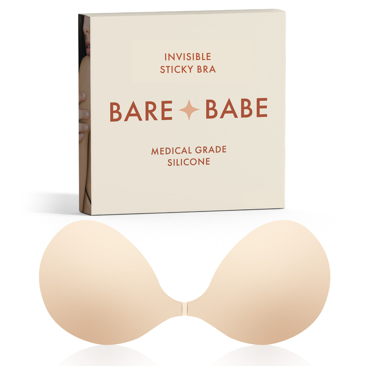 Silicone Sticky Bra in Creme, a reusable strapless, backless stick-on bra in medical-grade silicone with front clasp, shown with its Bare Babe Invisible Sticky Bra box on white