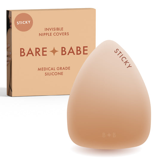 Triangle Adhesive Nipple Covers in Honey: sticky triangle silicone nipple cover marked Sticky, in front of its Honey Bare Babe box, invisible nipple covers in medical grade silicone