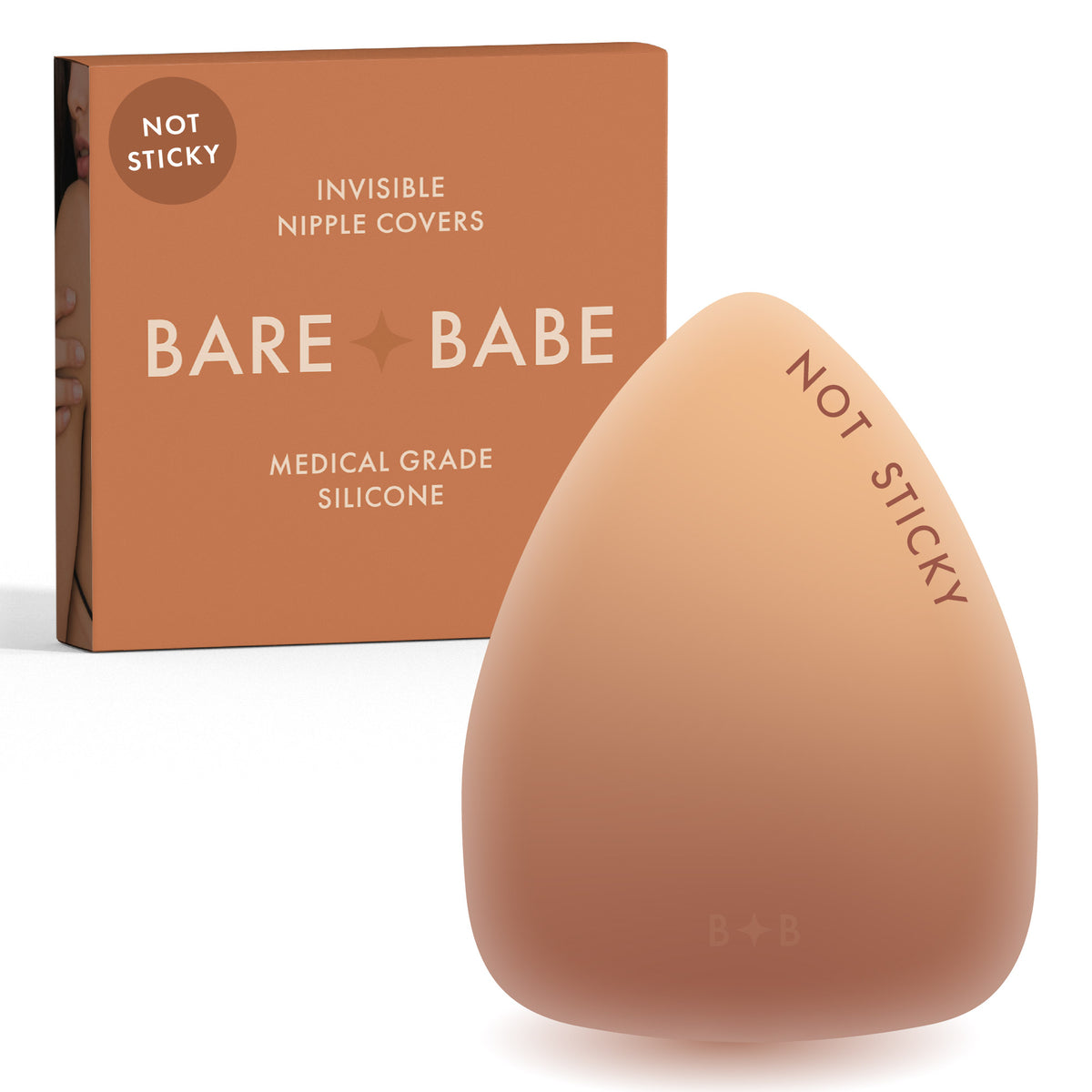 Triangle Non-Adhesive Nipple Covers in Caramel: grippy, not sticky triangle silicone nipple cover marked Not Sticky, in front of its Caramel Bare Babe box, invisible nipple covers in medical grade silicone