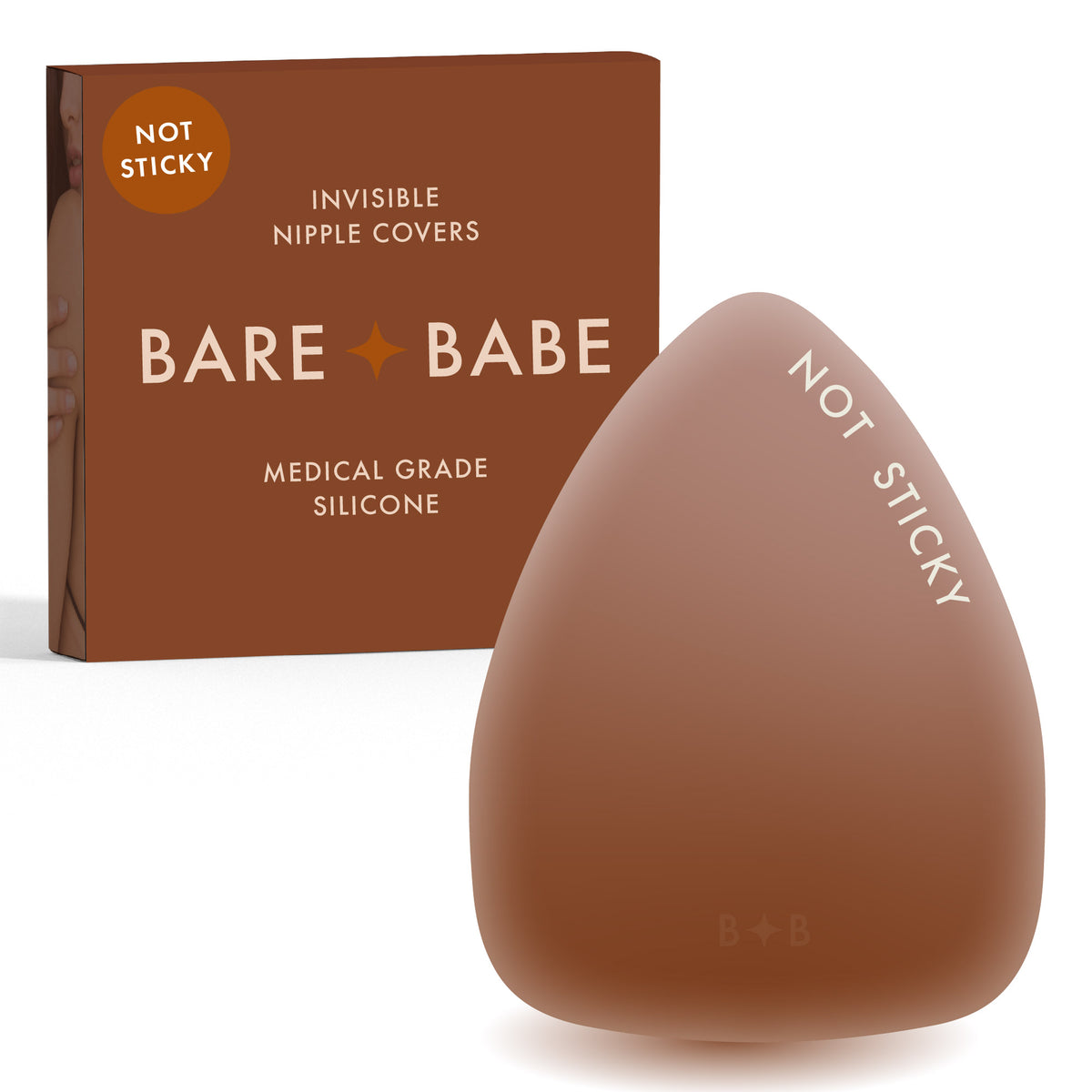 Triangle Non-Adhesive Nipple Covers in Cocoa: grippy, not sticky triangle silicone nipple cover marked Not Sticky, in front of its Cocoa Bare Babe box, invisible nipple covers in medical grade silicone