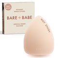 Triangle Non-Adhesive Nipple Covers in Creme: grippy, not sticky triangle silicone nipple cover marked Not Sticky, in front of its Creme Bare Babe box, invisible nipple covers in medical grade silicone